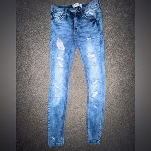 Low rise distressed skinny jeans